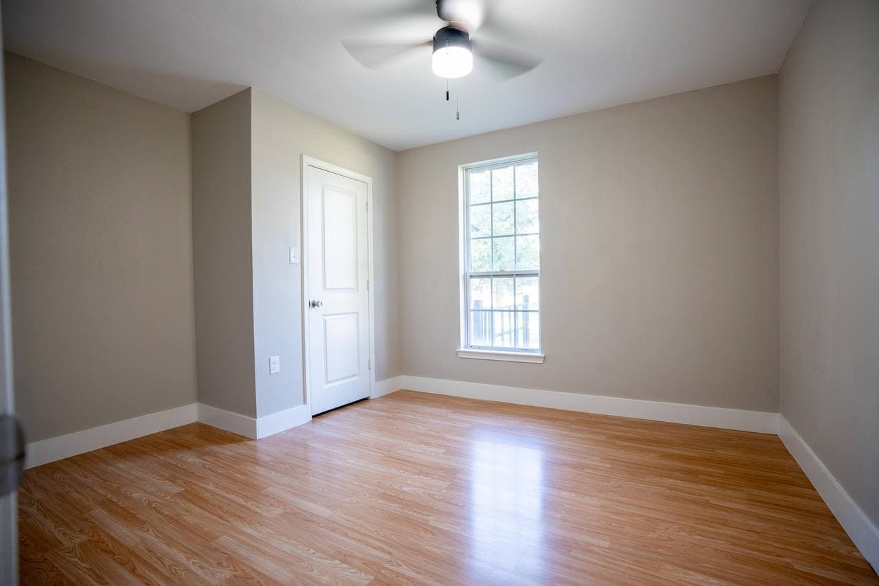 Bedroom renovation with new flooring and windows