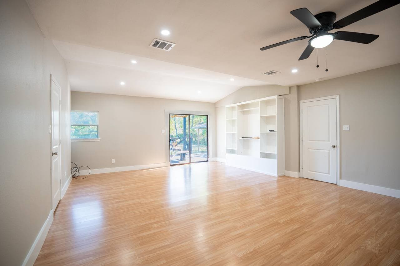 Open living and kitchen renovation with built-in shelving
