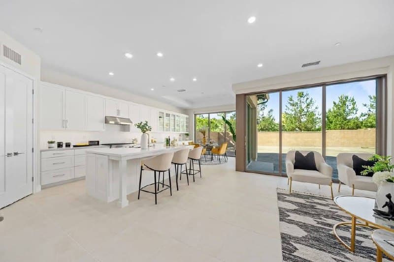 Modern open kitchen remodel with island and floor-to-ceiling windows