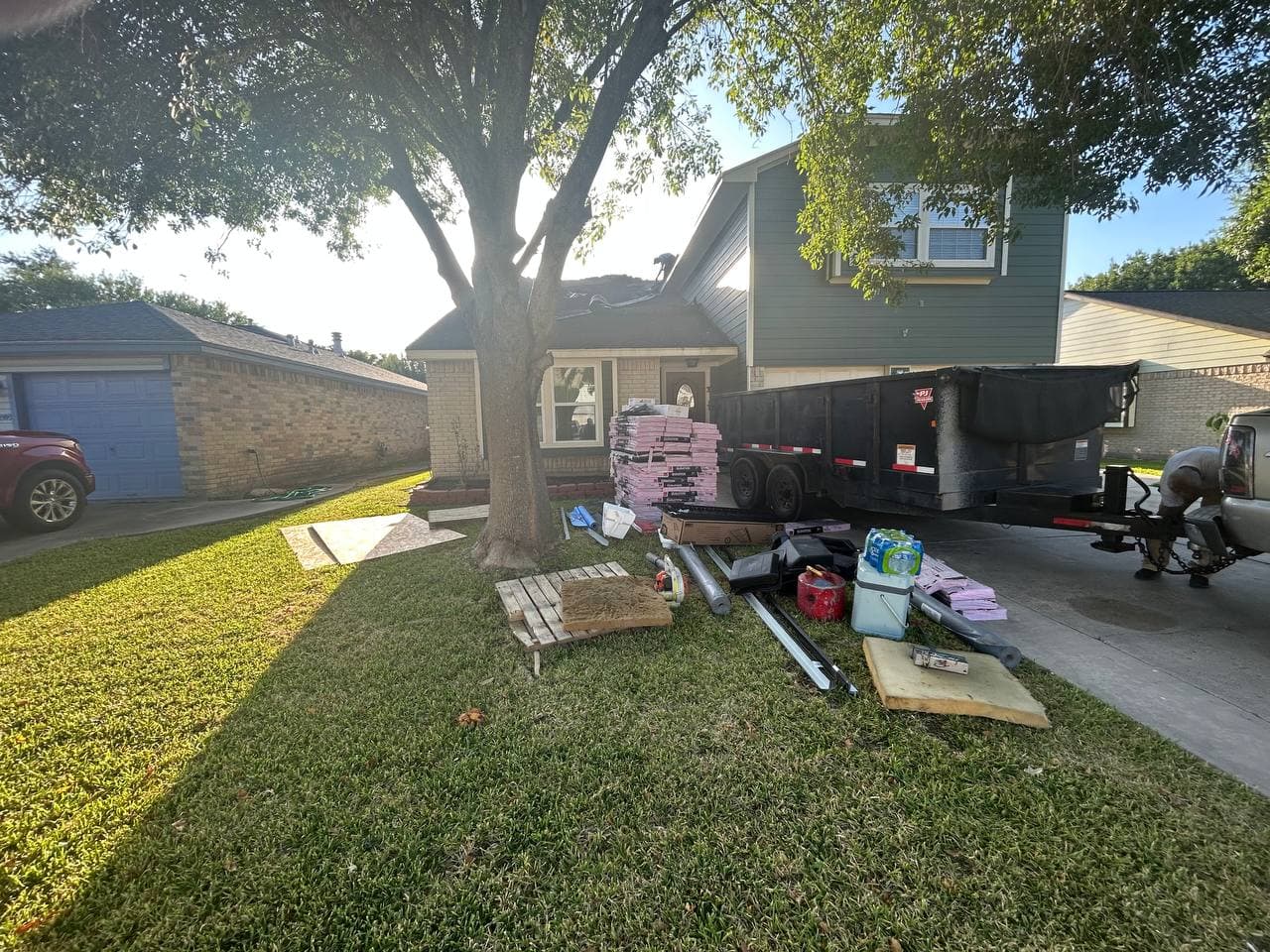Roofing project setup — materials staged, crew on site