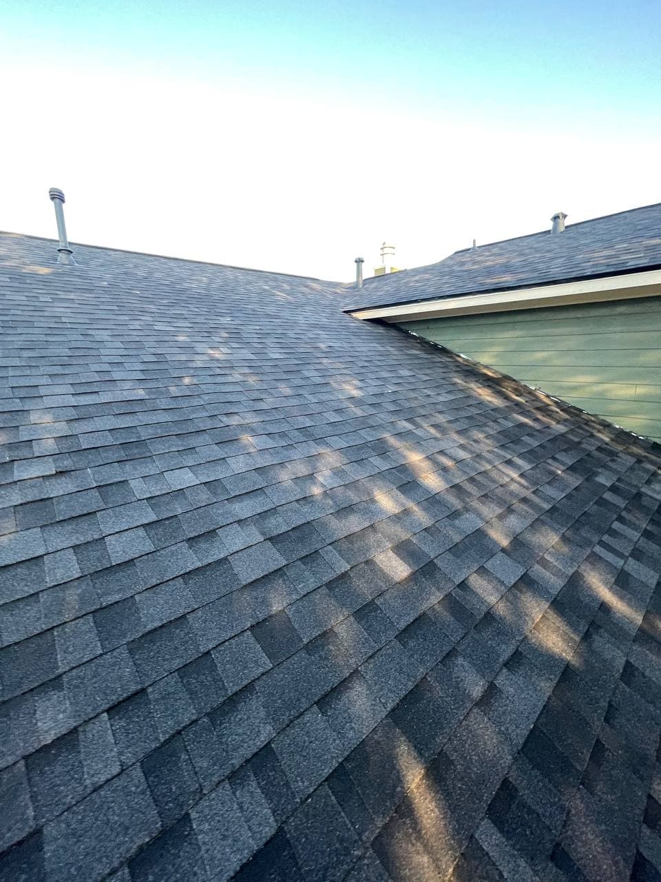 Clean shingle installation — valley and ridge detail